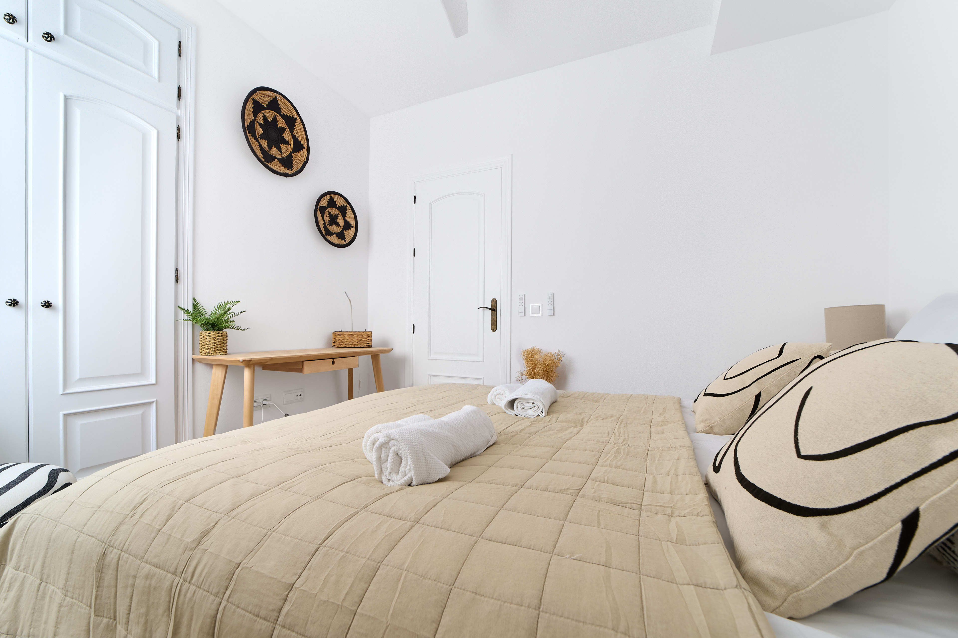 Calm Casa Wanda bedroom with soft neutral bedding