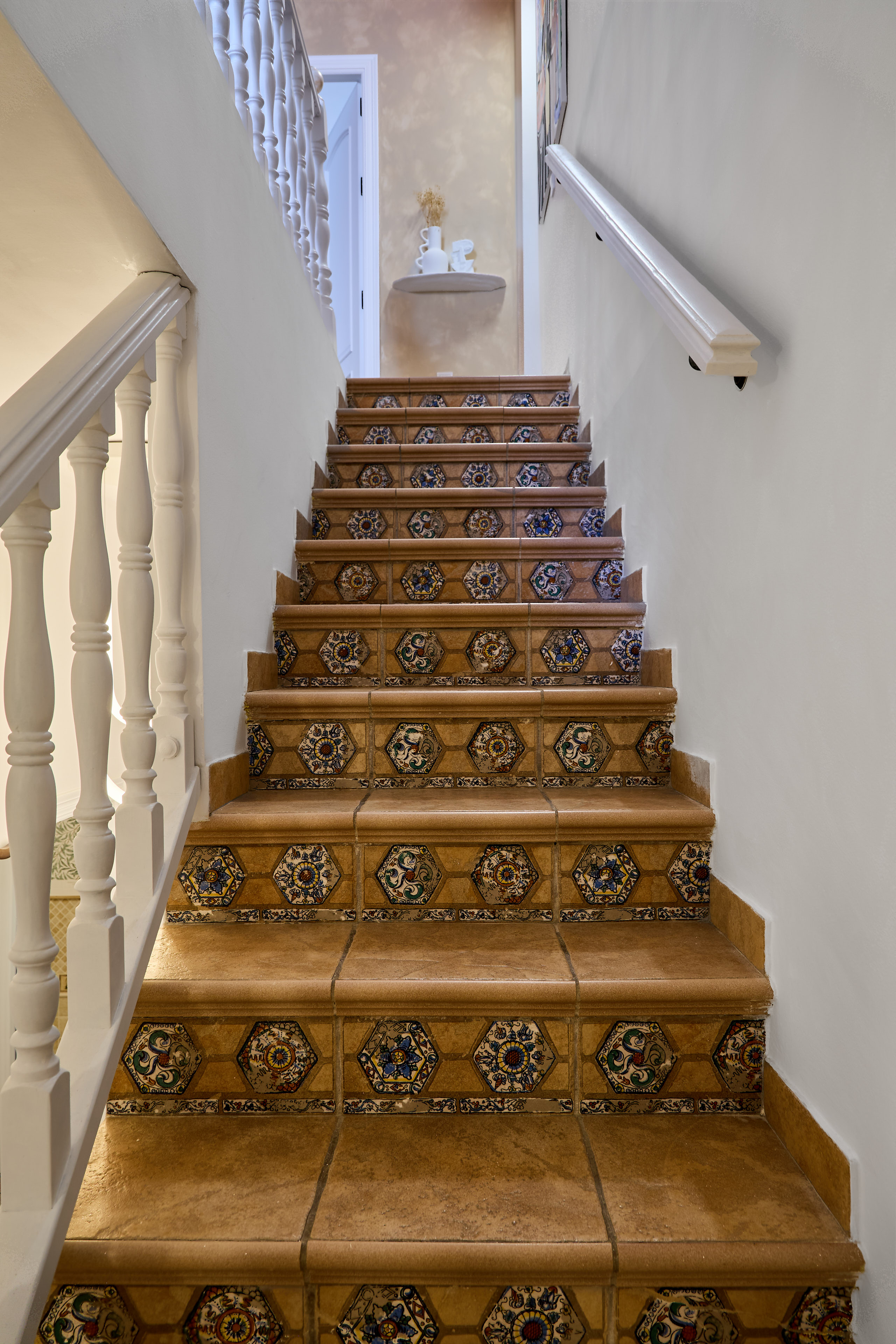 Traditional stairway and whitewashed details at Casa Wanda