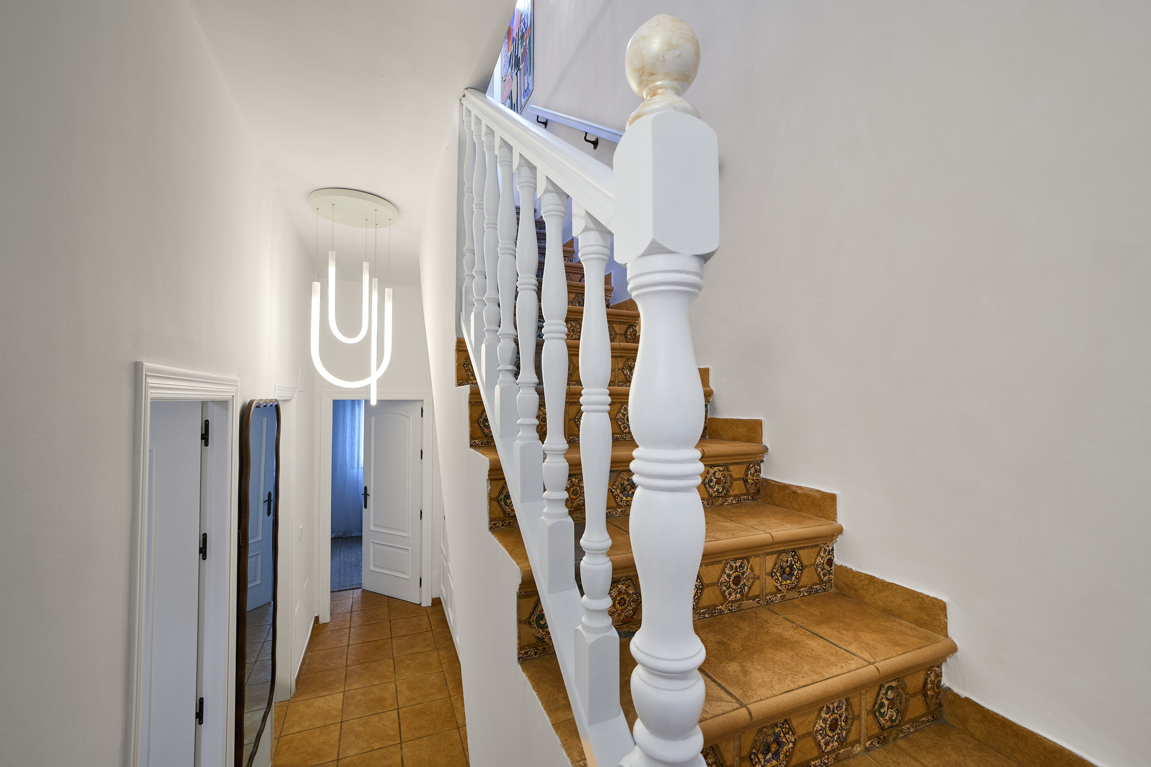 Traditional stairway and whitewashed details at Casa Wanda