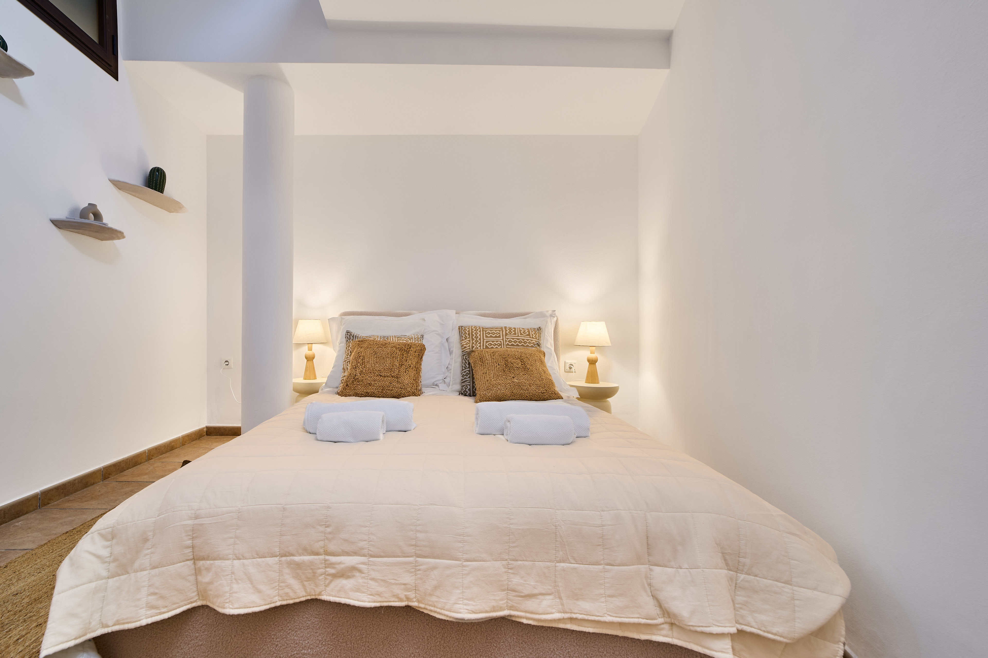 Calm Casa Wanda bedroom with soft neutral bedding